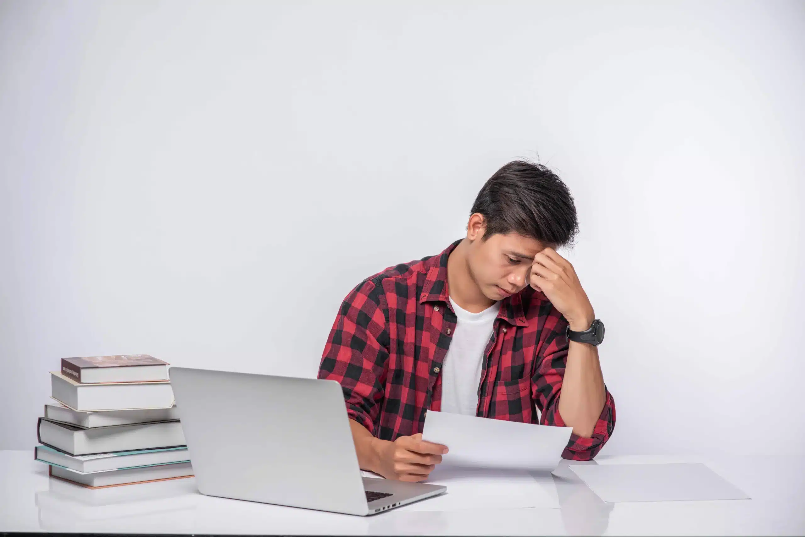 man-using-laptop-office-doing-document-analysis_11zon